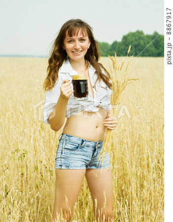 Girl with beer at field 8867917