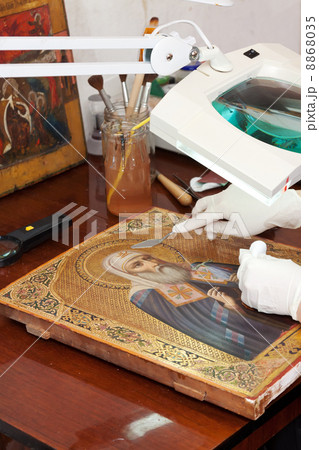 Closeup of accurate restoration of old icon Closeup of accurate restoration of old icon 8868035