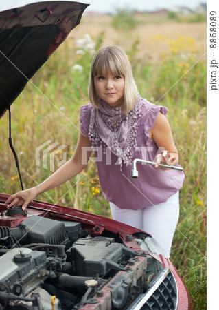 woman with her broken car 8868089
