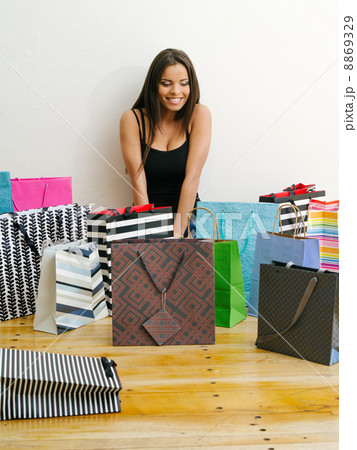 Shopaholic with all her shopping bags 8869329