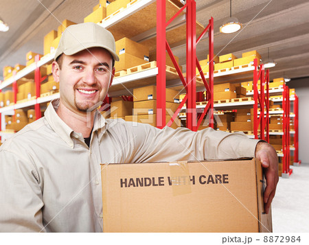 delivery man in warehouse 8872984