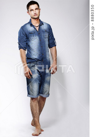 Full Length Portrait of Young Confident Barefoot Man in Blue Jeans Full Length Portrait of Young Confident Barefoot Man in Blue Jeans 8880350