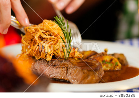 Eating in Bavarian restaurant or pub Eating in Bavarian restaurant or pub 8890239