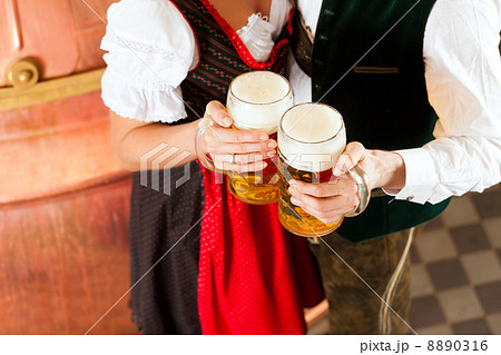 Man and woman with beer glass in brewery Man and woman with beer glass in brewery 8890316