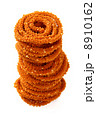 Traditional indian snack - chakali, isolated on white. 8910162