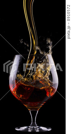 Cognac or brandy on a black 8910572