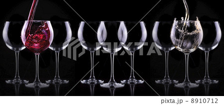 Elegant wine glass in black background 8910712