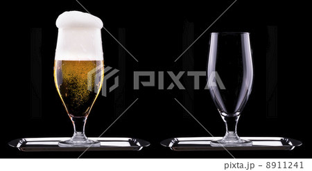 full and empty glass of light beer full and empty glass of light beer 8911241