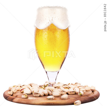 Frosty glass of light beer with pistachos 8911642