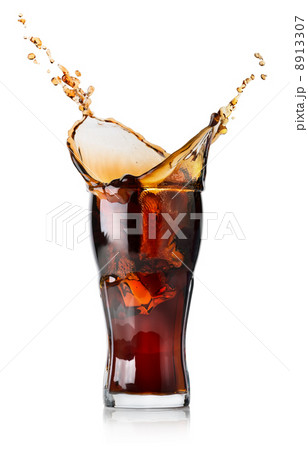 Splash of cola in a glass Splash of cola in a glass 8913307