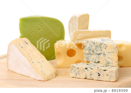 Various cheese on wooden plate. Various cheese on wooden plate. 8919309