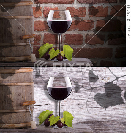 grapes and wine glass on a wooden vintage barrel 8919443