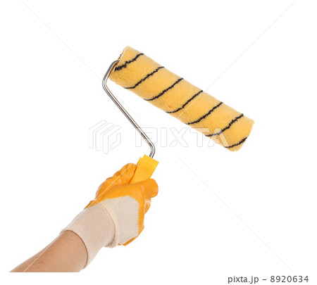 Hand with paintbrush roller. 8920634