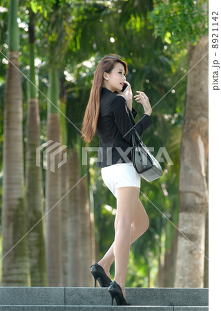 Young pretty businesswoman using smart phone Young pretty businesswoman using smart phone 8921142