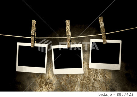 classic old polaroid photo Held By Clothespins 8957423