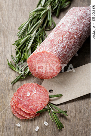 italian salami sausage slices with rosemary and sea salt 8965236