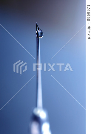 syringe close-up, focus on the drop syringe close-up, focus on the drop 8969971