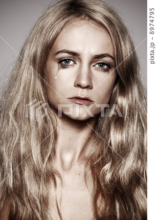 Sad woman with tears in her eyes Sad woman with tears in her eyes 8974795