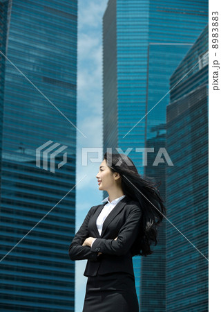 Young Office Lady in front of glass office building 8983883