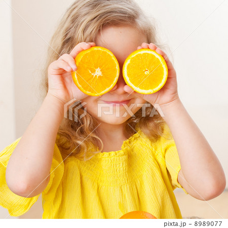Child with orange Child with orange 8989077