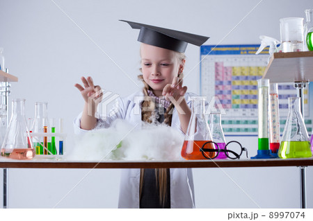 Image of cute chemist conducting experiment in lab 8997074