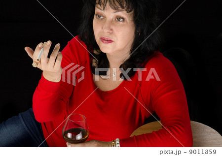 Drunk mature woman with a cigarette Drunk mature woman with a cigarette 9011859