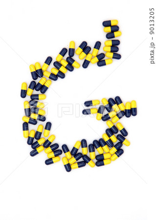 The letter G alphabet made of medical capsules 9013205