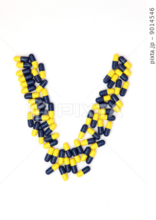 The letter V alphabet made of medical capsules 9014546