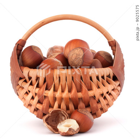 Hazelnuts in wicker basket Hazelnuts in wicker basket 9025575