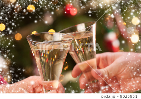 Man and Woman Toasting Champagne in Front of Lights Man and Woman Toasting Champagne in Front of Lights 9025951