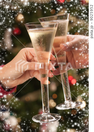 Man and Woman Toasting Champagne in Front of Lights 9025952
