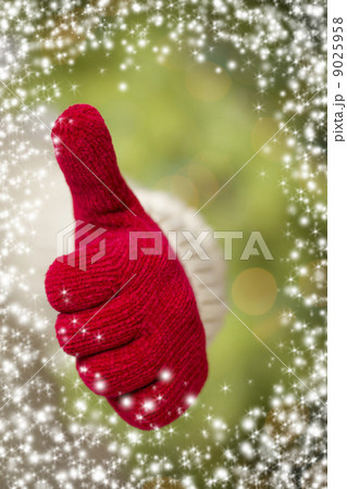 Woman Wearing Red Mittens Holding Out Thumbs Up Hand Sign Woman Wearing Red Mittens Holding Out Thumbs Up Hand Sign 9025958