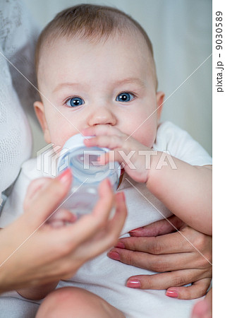 mother feeding by milk his baby infant from bottle mother feeding by milk his baby infant from bottle 9030589
