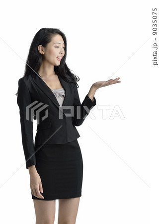 Young business woman presenting studio white background Young business woman presenting studio white background 9035075