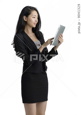 Young business woman using ipad digital tablet studio white background 9041329