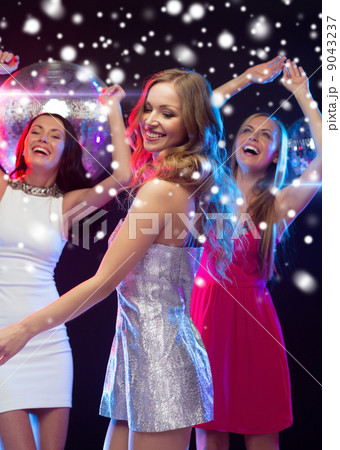 three smiling women dancing in the club three smiling women dancing in the club 9043237