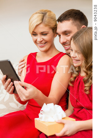 smiling family with tablet pc smiling family with tablet pc 9043238