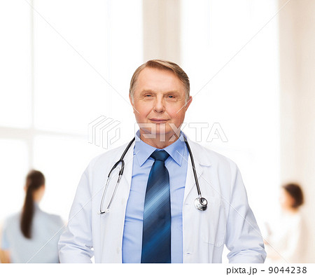 smiling doctor or professor with stethoscope smiling doctor or professor with stethoscope 9044238