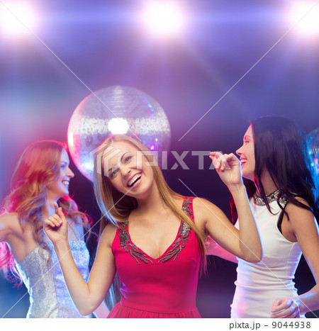 three smiling women dancing in the club three smiling women dancing in the club 9044938