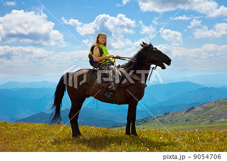 Female rider on horseback Female rider on horseback 9054706