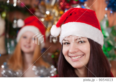 girls in Christmas hat at home 9054813