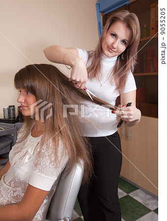 hairdresser working with long-haired girl hairdresser working with long-haired girl 9055205