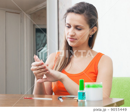 beauty woman looks to  nails 9055449