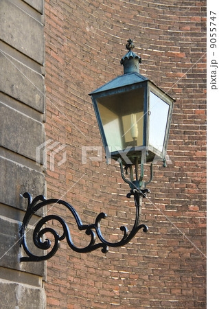 Lamp in retro style on a brick wall. Netherlands Lamp in retro style on a brick wall. Netherlands 9055747