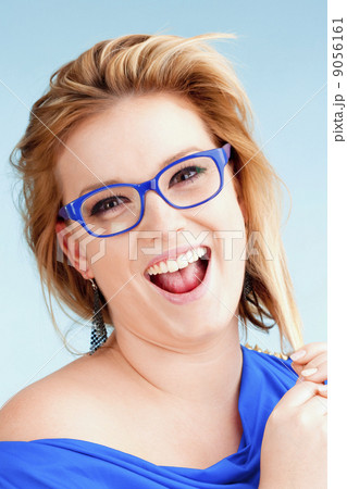 Portrait of Young Woman with Blond Hair Smiling 9056161