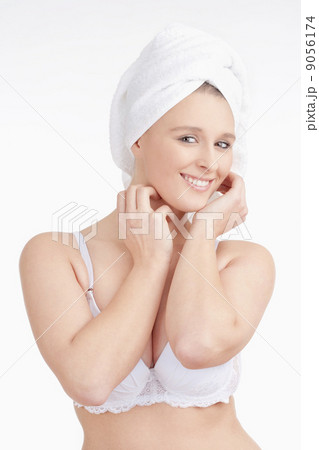 Beautiful Young Woman with Towel on her Head Smiling Beautiful Young Woman with Towel on her Head Smiling 9056174
