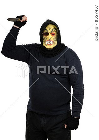 Maniac in a mask waves a knife 9057407