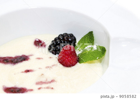 semolina porridge with berries decorated with berry jam 9058582
