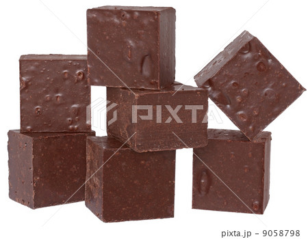 Cubes of chocolate close up isolated. 9058798