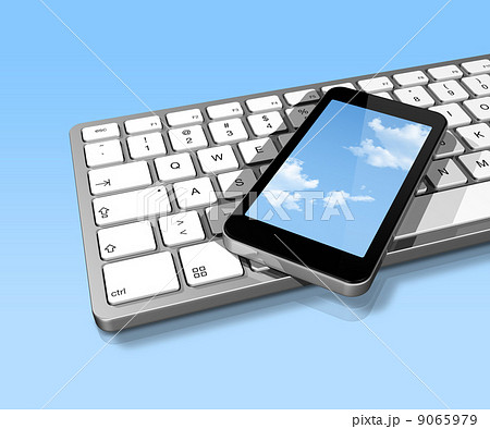 mobile phone on a computer keyboard mobile phone on a computer keyboard 9065979